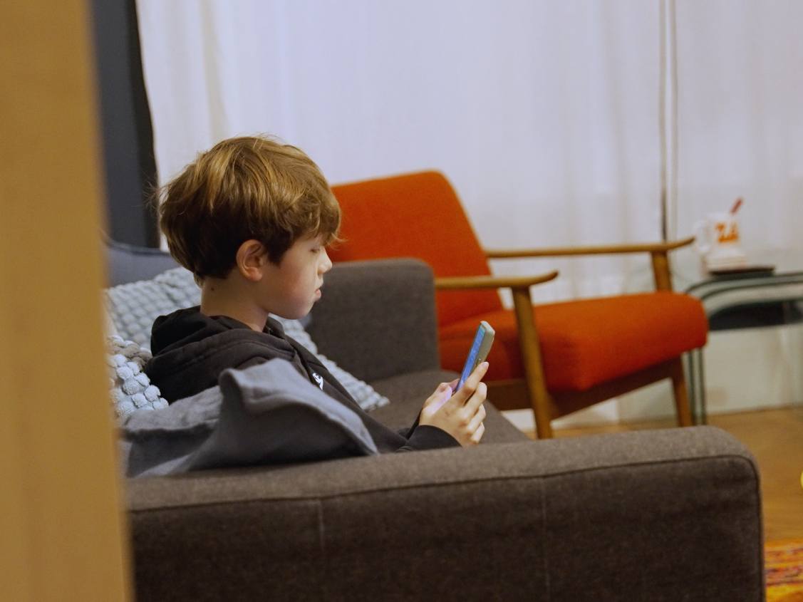 Child using Loupe indoors